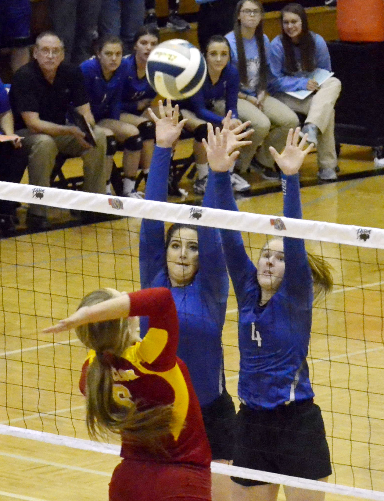 Tara Foltz (4), Rebecca Keller (other HSF player) block, Mary Nibbe (red) attacking.JPG